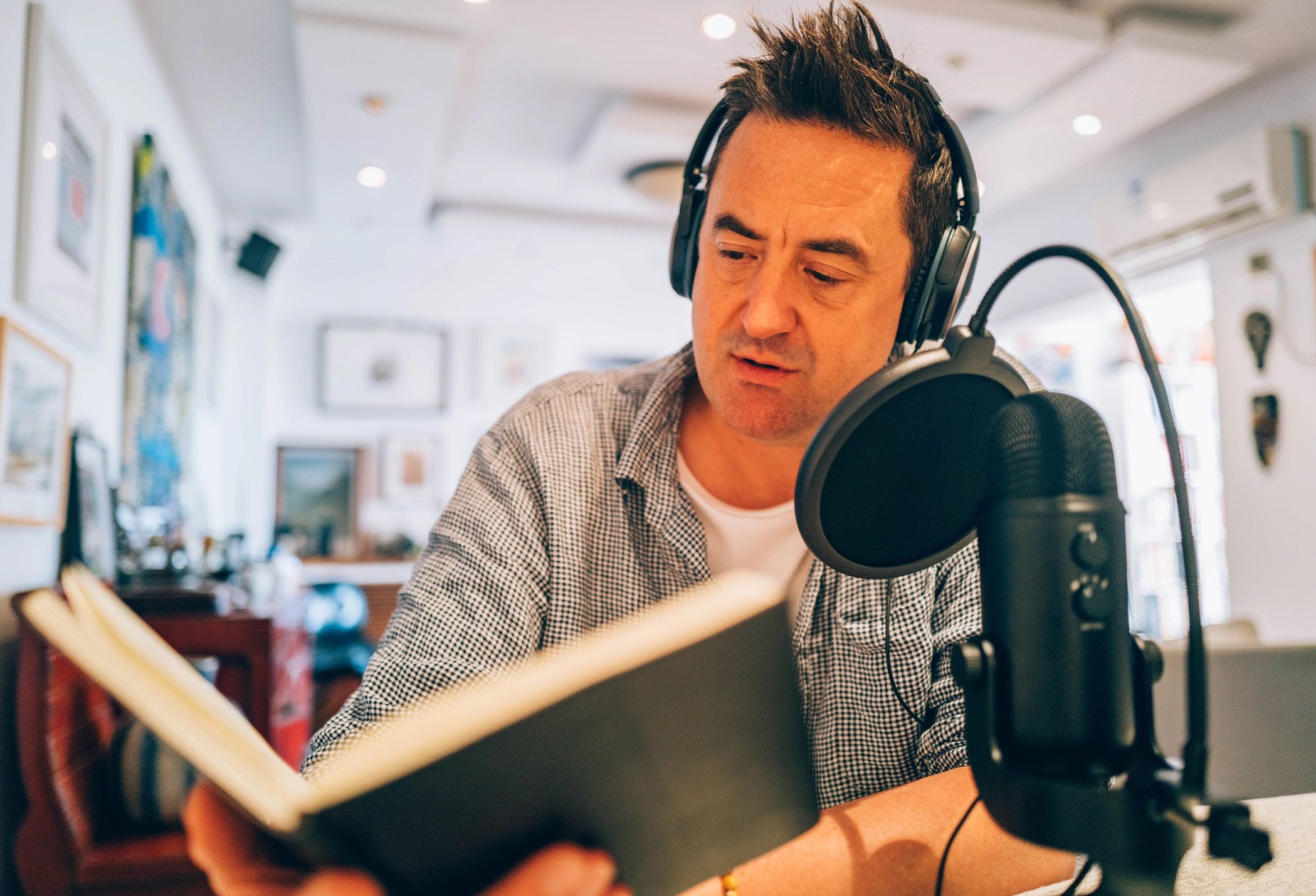 Performer recording expressive character voice work in a studio